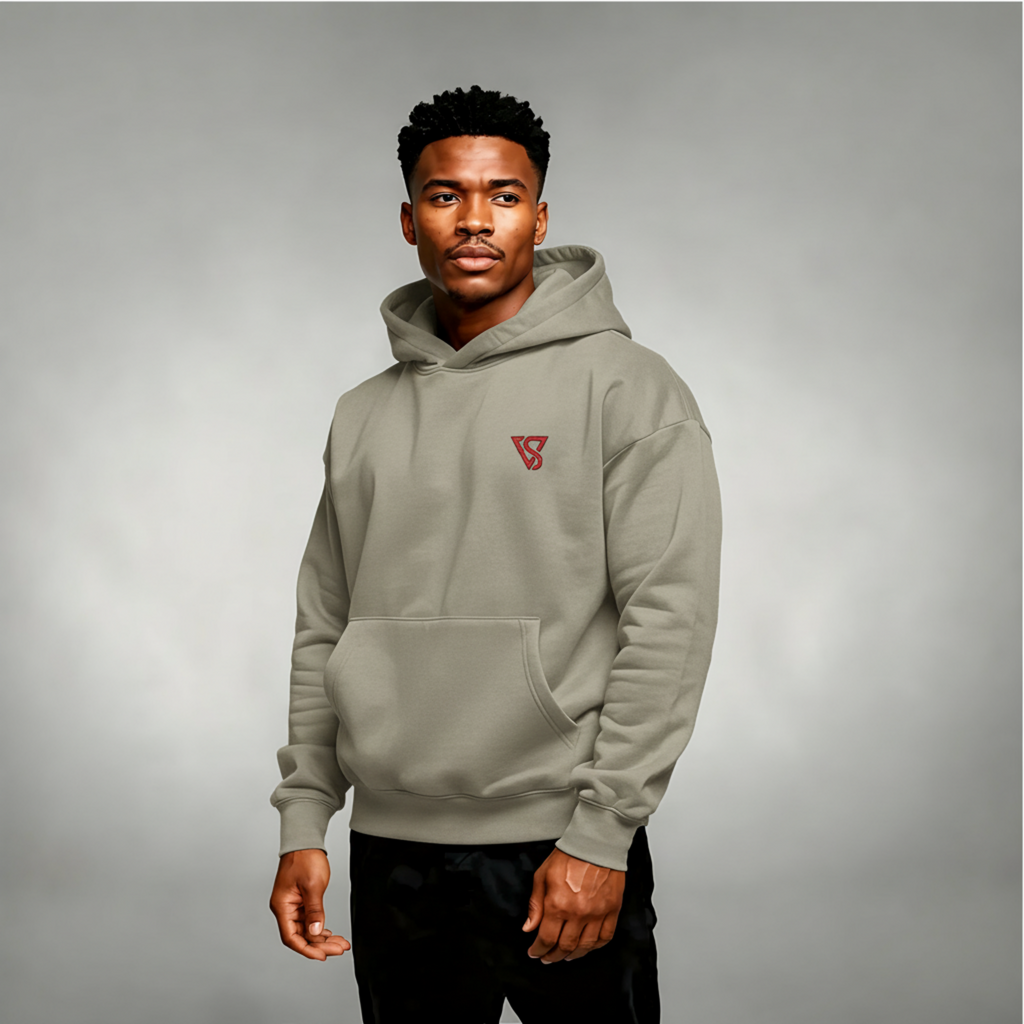 Man wearing a gray hoodie with a red logo on a gray background