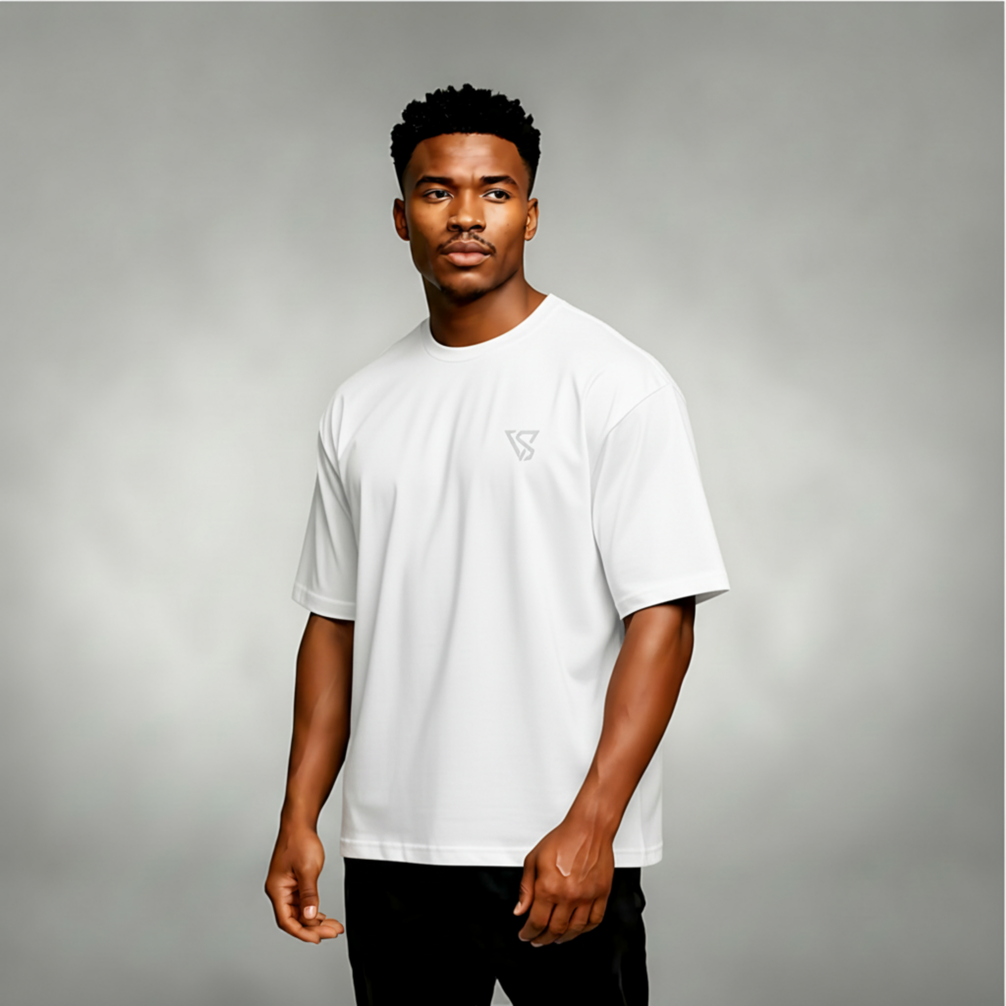 Man wearing a white t-shirt with a logo on a gray background