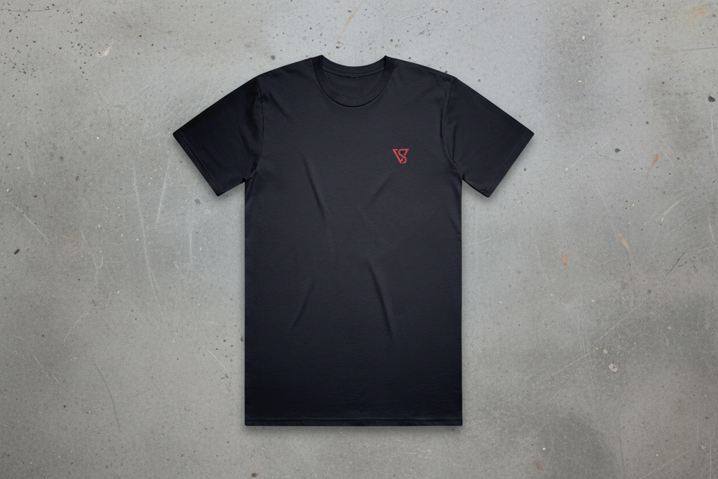 Black t-shirt with a red logo on a conrete background