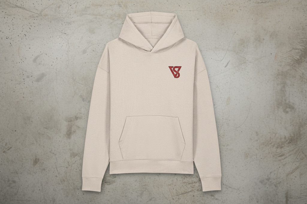Beige hoodie with a red logo on a gray concrete background