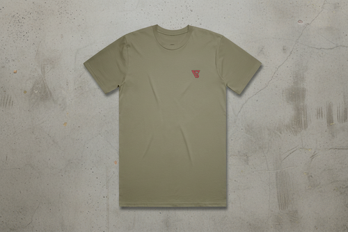 Olive green t-shirt with a small red logo on a concrete background